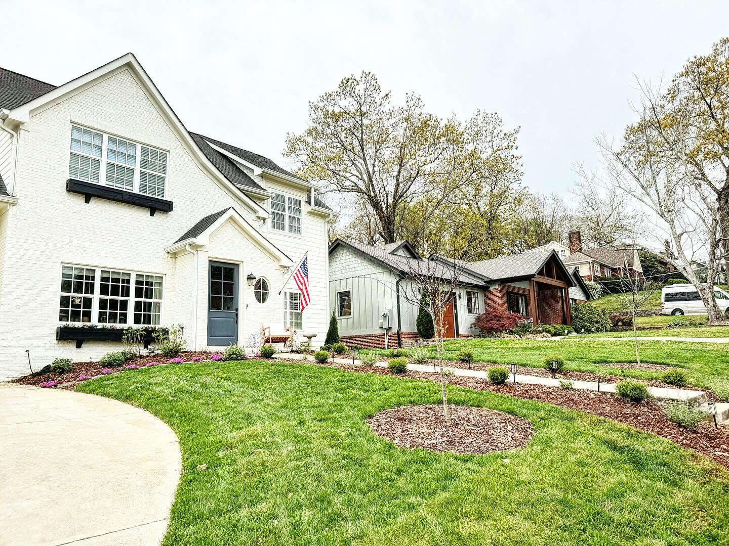 White home with new front lawn design