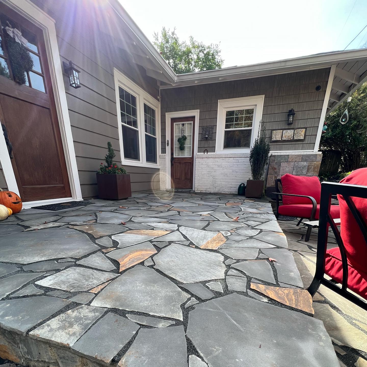 Flagstone patio behind house