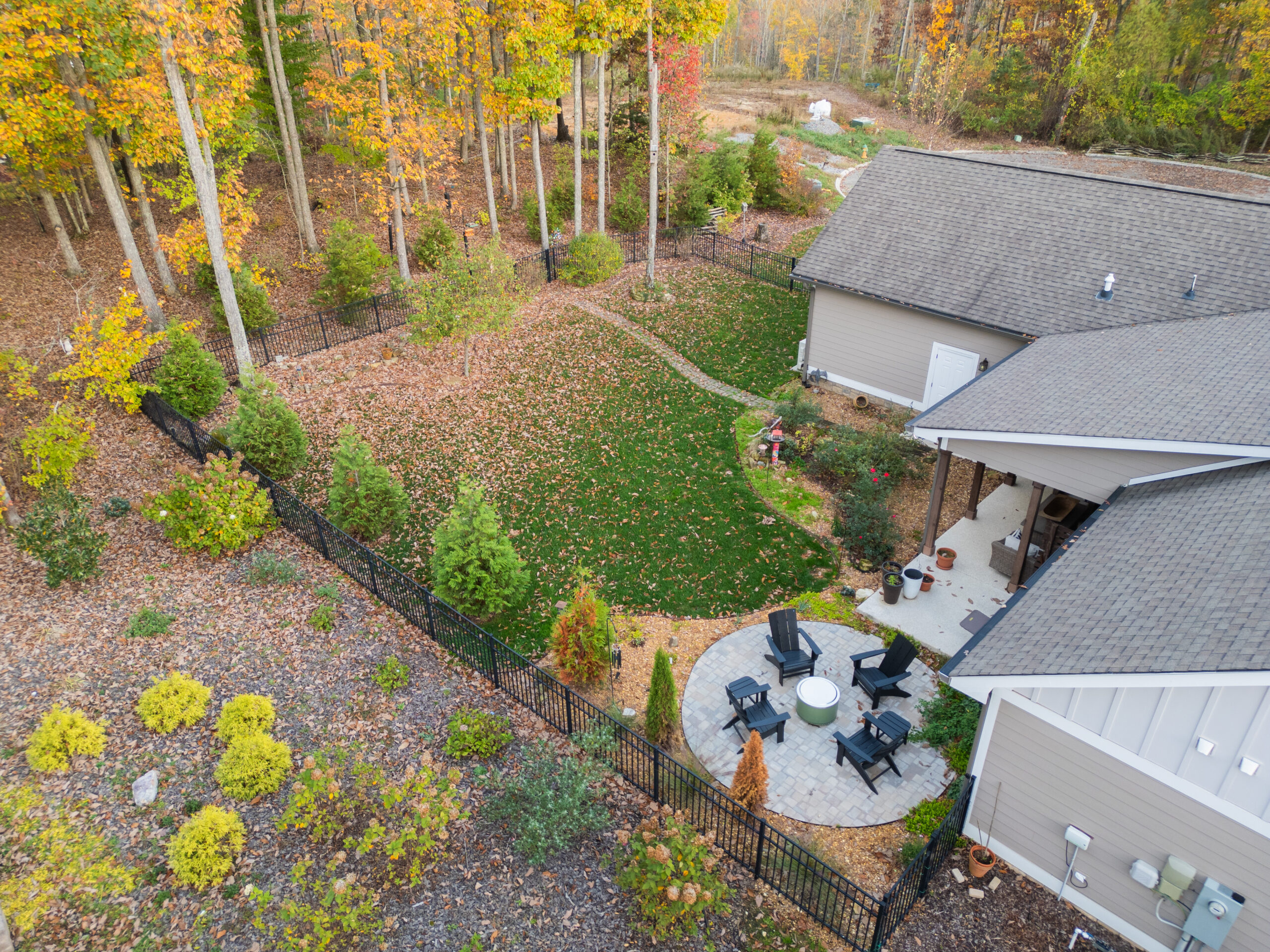 Backyard design-build with patio sitting area in East Brainerd